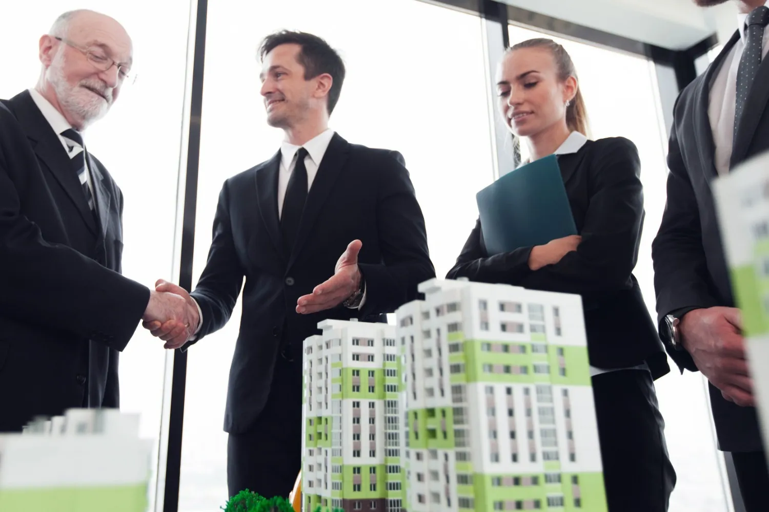 Property advisers discussing a housing development and landlord rent options